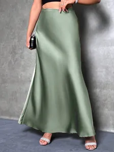 Close-up detail of elegant sage green high-waist satin midi skirt with silky texture