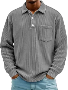 Close-up of a men's grey corduroy long-sleeved polo shirt with chest pocket detail