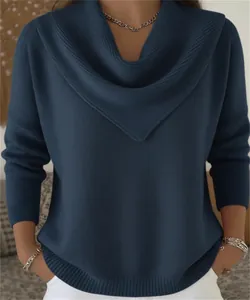Close-up of a stylish blue waffle knit sweater with a draped V-neckline design