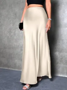 Elegant high-waisted champagne satin maxi skirt for women with a sleek flowing silhouette
