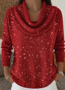 Close-up of sparkly red knit fabric on a long-sleeve winter top for women.