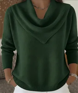 Close-up of dark green waffle-knit sweater featuring a stylish cowl neck design.