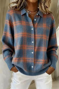 Detailed close-up view of a blue and orange plaid knit cardigan with lapel and buttons.