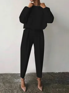 Elegante completo casual nero due pezzi con top a maniche lunghe e pantaloni a pieghe