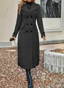 Detailed view of dark grey long wool coat with lapel collar and double-breasted buttons