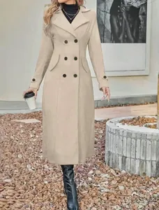 Elegant full-length view of a beige double-breasted wool coat styled with black boots