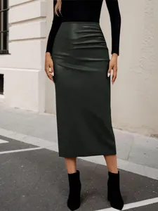 Elegant high-waisted dark green faux leather midi skirt with ruched detail and slim fit.