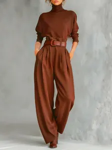 Chic brown two-piece set with turtleneck top and high-waisted wide-leg trousers.