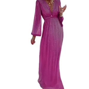 Close-up of elegant fuchsia sequin fabric on a long sleeve V-neck party maxi dress