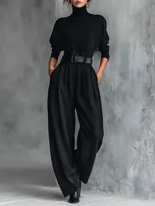 Elegant black turtleneck top and high-waist wide-leg pants two-piece set with belt