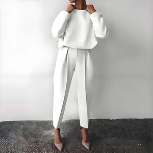 Elegant white casual two-piece set with long sleeve top and pleated trousers for women