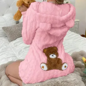 Detailed back view of pink fuzzy hooded romper with a cute plush teddy bear patch