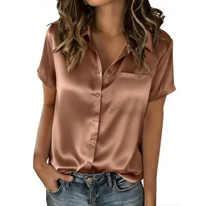 Close-up detail of women's short-sleeved bronze satin shirt with turn-down collar