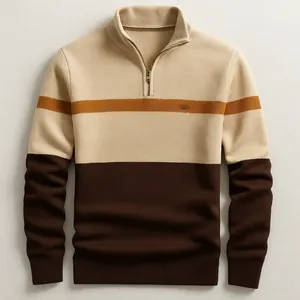 Detailed view of a men's half-zip knit sweater with brown and beige color-blocking.
