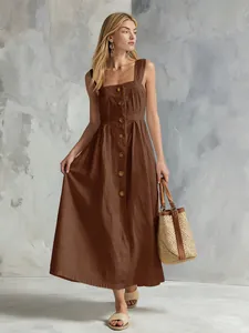 Elegant brown sleeveless button-down midi dress with a full skirt for summer style.