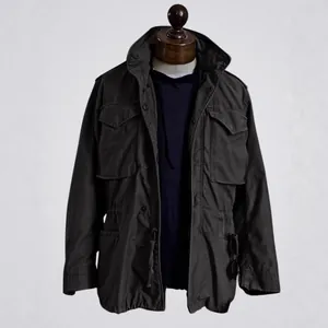 Vintage M65 field jacket with multiple pockets for men, workwear style on mannequin