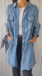 Detailed view of a women's light blue oversized denim-style shirt jacket in a casual outfit