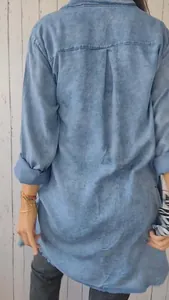 Back view of a casual loose blue denim-look shirt for women with washed texture
