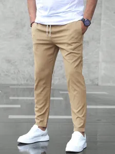 Men's khaki casual joggers with drawstring waist and tapered fit for summer business wear.