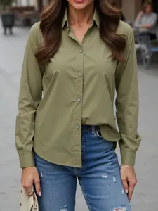Front view of an olive green long-sleeved shirt for women in a professional office setting
