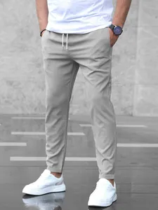 Front view of men's slim fit light gray casual cropped pants with drawstring waist