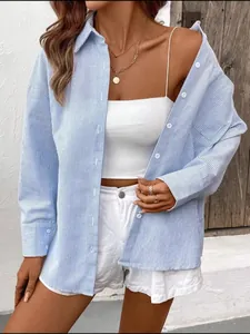 Detail of blue striped button-down shirt with long sleeves and causal fit