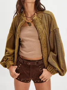 Close-up view showing the rich knit texture of a vintage mustard yellow oversized cardigan