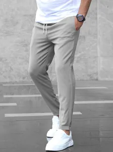 Detailed side view of men's slim fit light gray ankle-length casual trousers.
