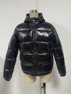 Front view of a shiny black men's hooded puffer jacket with high-gloss quilted design