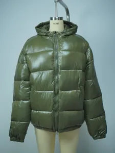 Detailed view of glossy dark green men's hooded puffer jacket with quilted texture