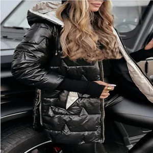 Detail view of women's black glossy hooded puffer jacket featuring triple zippers