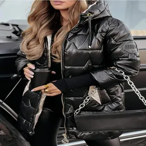 Detail of glossy black quilted puffer jacket with hood and triple zipper design