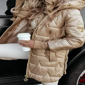 Detailed view of a stylish champagne gold hooded puffer jacket with triple zipper accents