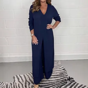 Elegant navy blue two-piece lounge set featuring long split top and wide-leg trousers