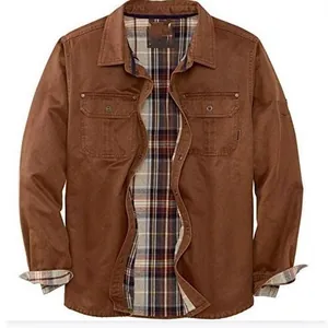 Close-up detail of a men's brown heavy-duty biker jacket featuring a plaid lining.