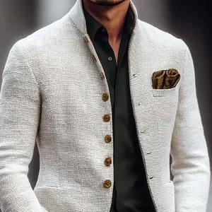 Detailed view of men's textured beige stand-collar jacket with pocket square