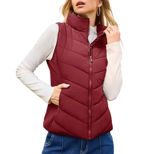 Detailed side view of burgundy quilted puffer vest with zipper closure