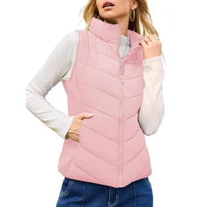 Detailed view of women's pink quilted puffer vest with high collar and zipper closure