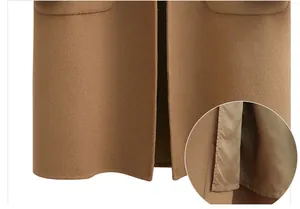Close-up of elegant camel double-sided wool coat hem and smooth inner lining detail