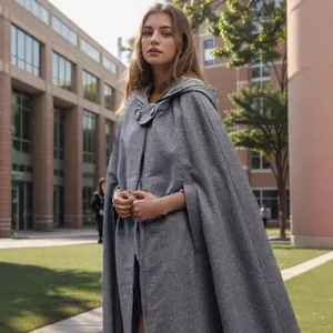 Elegant women's long grey hooded wool cloak cape coat for winter outdoor fashion.