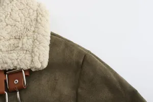Detail of a men's faux suede shearling coat showing the soft collar and leather buckle