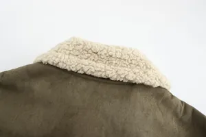 Close-up detail of olive green faux suede jacket featuring soft white shearling collar