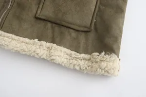 Close-up detail of men's olive green faux suede coat with white shearling lining and hem.