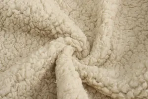 Macro view of soft cream sherpa fleece material texture for winter men's coat detail