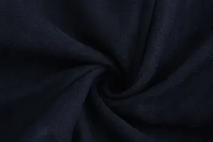 Detailed macro view showing the soft navy blue wool fabric texture for a men's winter coat