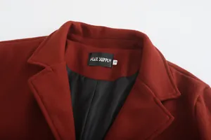 Close-up detail of a dark red wool coat neckline showing the FLEX SUPPLY brand label