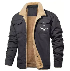 Detailed view of black men's work jacket with warm fleece lining and steer logo