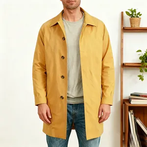 Close-up detail of yellow single-breasted trench coat for men with a classic lapel collar