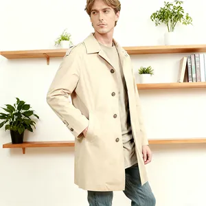 Detail view of a men's slim fit beige trench coat with lapel and single-breasted buttons