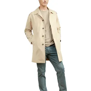 Detail view of men's slim fit khaki trench coat with lapel and single-breasted design.